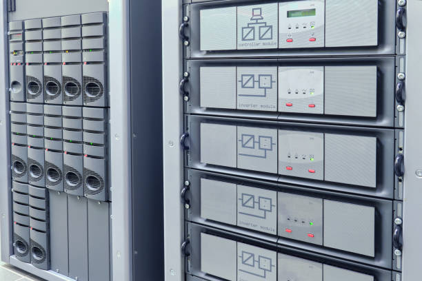 Open power distribution panel showing redesigned rectifier modules and clean cable management in a server room